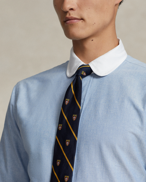 In our signature oxford cloth, this shirt achieves a polished Polo look with its contrasting club collar and genuine mother-of-pearl buttons.