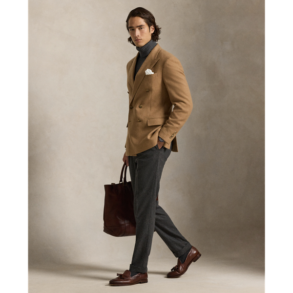 This unisex Polo blazer offers more structure in the chest and shoulders along with full lining. This version is made with fine camel hair twill that was custom-developed with the historic Joshua Ellis mill, which has been creating luxury textiles in England for more than 250 years.