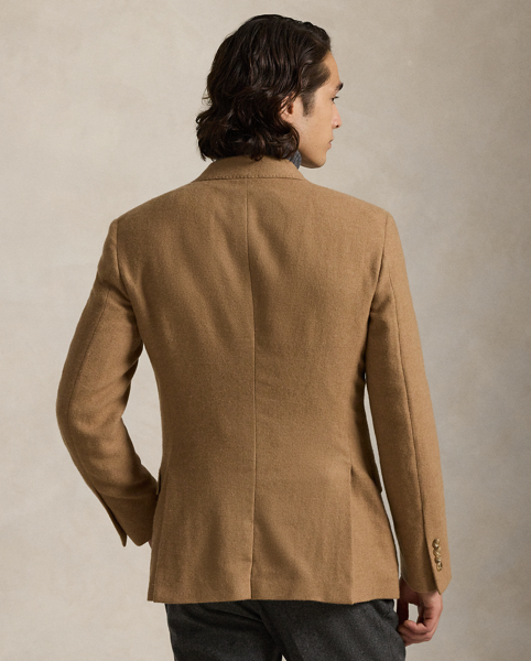 This unisex Polo blazer offers more structure in the chest and shoulders along with full lining. This version is made with fine camel hair twill that was custom-developed with the historic Joshua Ellis mill, which has been creating luxury textiles in England for more than 250 years.