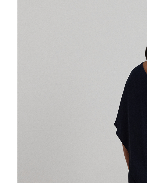 An elegant choice for your next occasion, this statuesque one-shoulder jumpsuit is defined by a cascading cape. Its luxurious georgette fabrication creates fluid movement with each step.