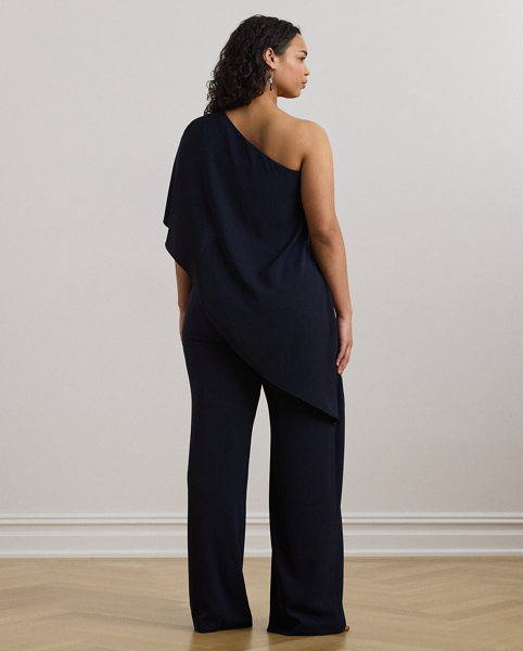 An elegant choice for your next occasion, this statuesque one-shoulder jumpsuit is defined by a cascading cape. Its luxurious georgette fabrication creates fluid movement with each step.