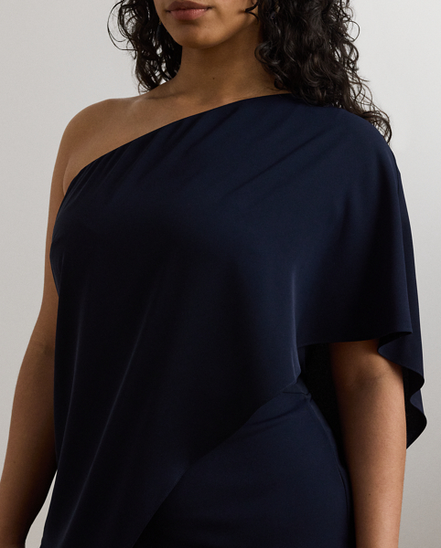 An elegant choice for your next occasion, this statuesque one-shoulder jumpsuit is defined by a cascading cape. Its luxurious georgette fabrication creates fluid movement with each step.