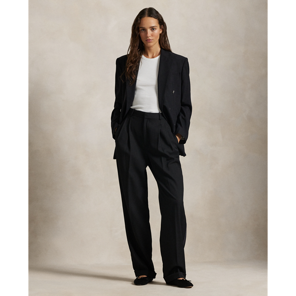 A pleated front construction and tonal silk faille side stripes define the tuxedo-inspired style of these wide-leg wool trousers.
