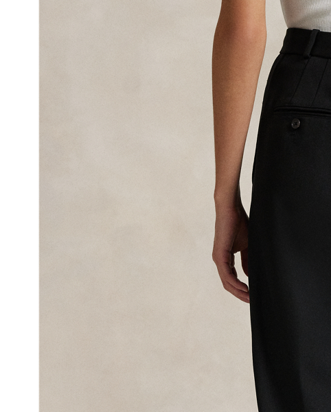 A pleated front construction and tonal silk faille side stripes define the tuxedo-inspired style of these wide-leg wool trousers.