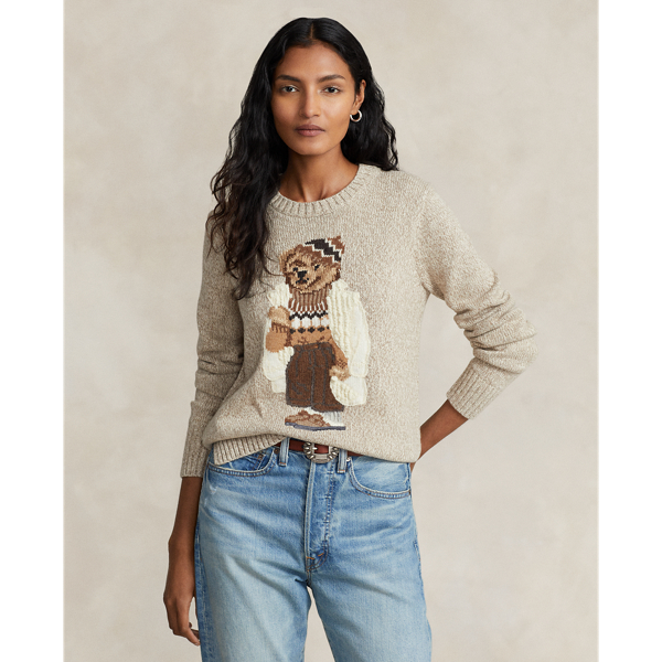 This soft crewneck jumper features our iconic mascot intricately intarsia-knit and embroidered for additional texture. Here, the Polo Bear is stylishly dressed in a layered cold weather look in cream and khaki hues.