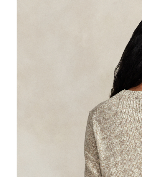 This soft crewneck jumper features our iconic mascot intricately intarsia-knit and embroidered for additional texture. Here, the Polo Bear is stylishly dressed in a layered cold weather look in cream and khaki hues.