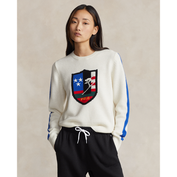 Prominently featuring an oversized crest intarsia-knit at the centre-front, this wool crewneck jumper is inspired by  Ralph Lauren Lauren's celebrated winter collections from the late 1980s and early 1990s. The crest features the now-iconic "Downhill Skier" graphic – a silhouette of a skier barrelling down a steep run – that originally debuted on small shield patches at the chest of  Ralph Lauren Lauren's jackets, long-sleeve Polo shirts and socks in 1989.