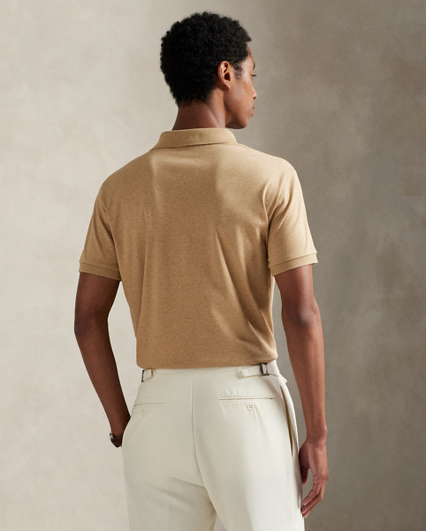 An American style standard since 1972, the Polo shirt has been imitated but never matched. Over the decades, Ralph Lauren Lauren has re-imagined his signature style in a wide array of colours and fits, yet all retain the quality and attention to detail of the iconic original. This trim version is made from luxe cotton interlock, which features an ultra-soft finish.