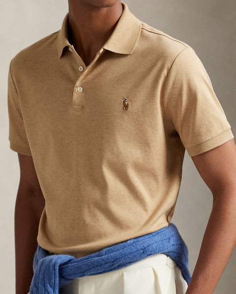 An American style standard since 1972, the Polo shirt has been imitated but never matched. Over the decades, Ralph Lauren Lauren has re-imagined his signature style in a wide array of colours and fits, yet all retain the quality and attention to detail of the iconic original. This trim version is made from luxe cotton interlock, which features an ultra-soft finish.