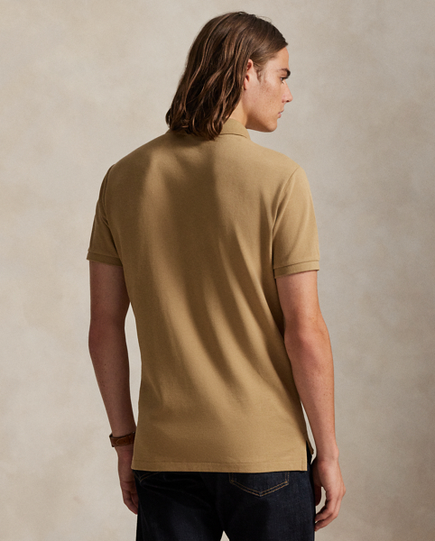 An American style standard since 1972, the Polo shirt has been imitated but never matched. Over the decades, Ralph Lauren Lauren has re-imagined his signature style in a wide array of colours and fits, yet all retain the quality and attention to detail of the iconic original. This trim version is made from our highly breathable cotton mesh, which offers a textured look and a soft feel.