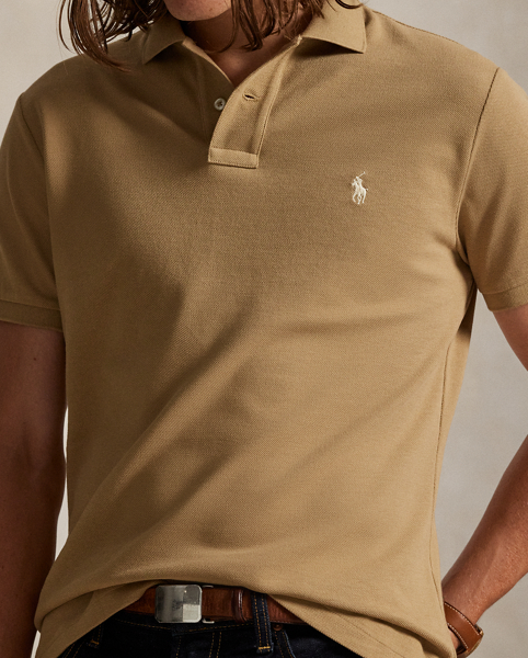 An American style standard since 1972, the Polo shirt has been imitated but never matched. Over the decades, Ralph Lauren Lauren has re-imagined his signature style in a wide array of colours and fits, yet all retain the quality and attention to detail of the iconic original. This trim version is made from our highly breathable cotton mesh, which offers a textured look and a soft feel.