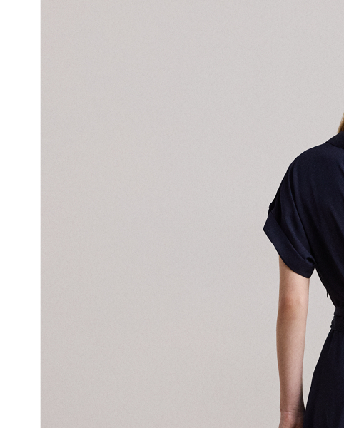 This beautiful dress balances a menswear-inspired collar and roll-tab sleeves with a feminine surplice neckline and a self-belt to create a look that is casual yet refined. "LRL"-engraved buttons afford an iconic finish.