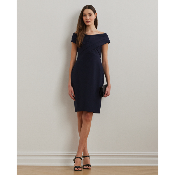 Smooth, delicate crepe creates a body-hugging silhouette in this cocktail dress, which is designed with an overlapping off-the-shoulder neckline for a style that is equal parts alluring and sophisticated.