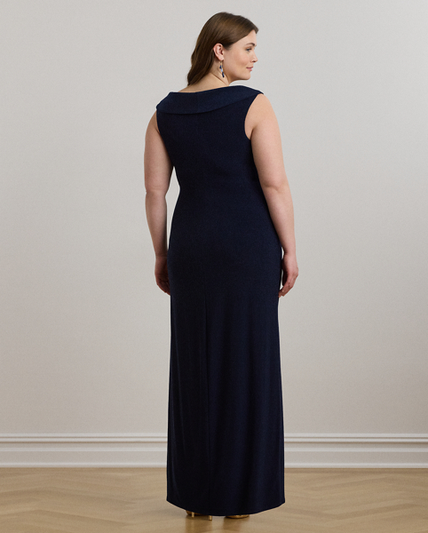 Crafted from smooth, body-hugging jersey, this column gown is designed with an elegant off-the-shoulder silhouette and a chic twist detail on the waist. A slit in the skirt creates ease of movement.