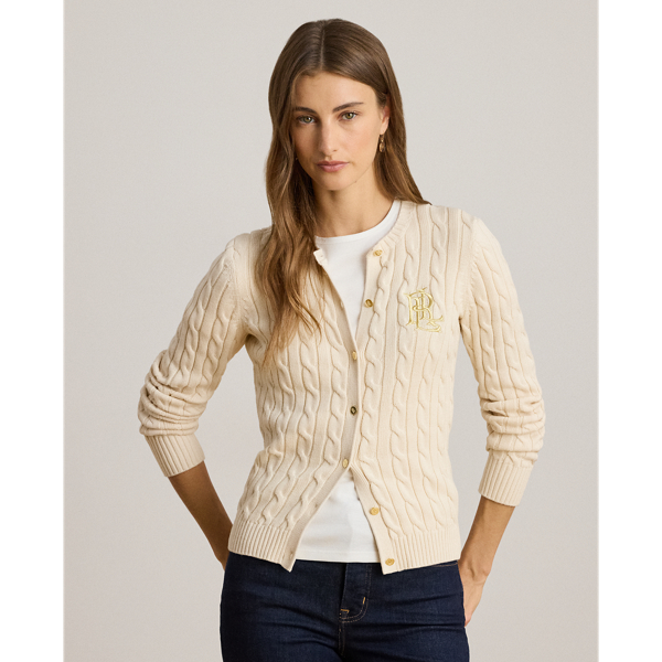 Crafted with gassed cotton for an amazingly soft feel, this classic cable-knit cardigan is accented with "LRL"-engraved buttons and Lauren's signature embroidered logo on the chest for an iconic Lauren  Ralph Lauren Lauren layering piece.
