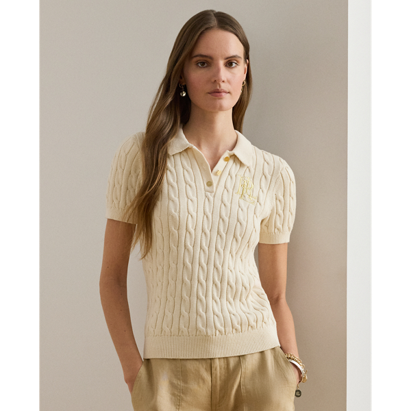 Crafted from combed cotton for a soft hand, this piece unites a timeless Polo shirt silhouette with the comfort of a cable-knit jumper. It's adorned with Lauren's signature embroidered logo and "LRL"-engraved buttons.