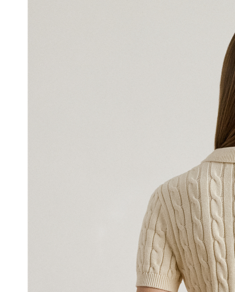 Crafted from combed cotton for a soft hand, this piece unites a timeless Polo shirt silhouette with the comfort of a cable-knit jumper. It's adorned with Lauren's signature embroidered logo and "LRL"-engraved buttons.