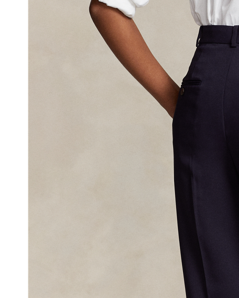 Crafted with fluid matte satin, these straight-leg trousers feature menswear-inspired details, including a pleated front waist and crisp creases along each leg.