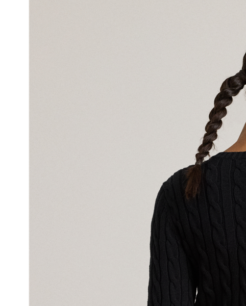 Crafted with gassed cotton for an amazingly soft feel, this classic cable-knit cardigan is accented with "LRL"-engraved buttons and Lauren's signature embroidered logo on the chest for an iconic Lauren  Ralph Lauren Lauren layering piece.