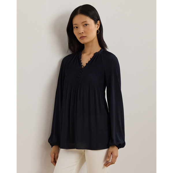 With billowing blouson sleeves, relaxed raglan seams and crisp pleating on the body and shoulders, this blouse is as comfortable as it is chic. It's realised in airy georgette for an effortless drape.