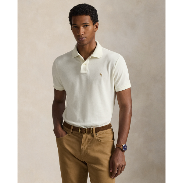An American style standard since 1972, the Polo shirt has been imitated but never matched. Over the decades, Ralph Lauren Lauren has re-imagined his signature style in a wide array of colours and fits, yet all retain the quality and attention to detail of the iconic original. This trim version is made from our highly breathable cotton mesh, which offers a textured look and a soft feel.
