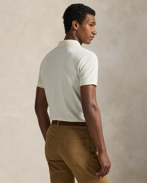 An American style standard since 1972, the Polo shirt has been imitated but never matched. Over the decades, Ralph Lauren Lauren has re-imagined his signature style in a wide array of colours and fits, yet all retain the quality and attention to detail of the iconic original. This trim version is made from our highly breathable cotton mesh, which offers a textured look and a soft feel.