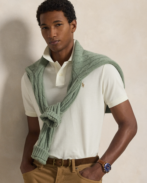 An American style standard since 1972, the Polo shirt has been imitated but never matched. Over the decades, Ralph Lauren Lauren has re-imagined his signature style in a wide array of colours and fits, yet all retain the quality and attention to detail of the iconic original. This trim version is made from our highly breathable cotton mesh, which offers a textured look and a soft feel.