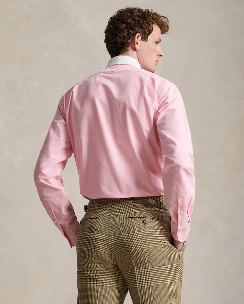 In our signature oxford cloth, this shirt achieves a polished Polo look with its contrasting club collar and genuine mother-of-pearl buttons.