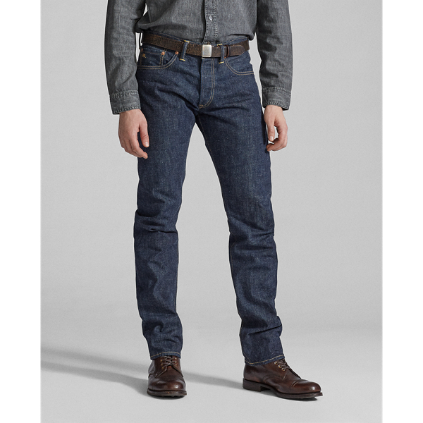 Straight-fitting jeans made in America from 13.75 oz. selvedge denim that is shuttle-woven in Japan. Cotton yarns are ring-spun and rope-dyed to achieve Double RL's deepest indigo shade with an authentic red-blue cast. Right-hand twill is custom-developed to create a "grin-through" effect in which the lighter-hued weft yarns are visible on the face of the cloth. Rinsed and specially treated for a soft, sun-dried effect. Sanforized to minimise shrinkage.