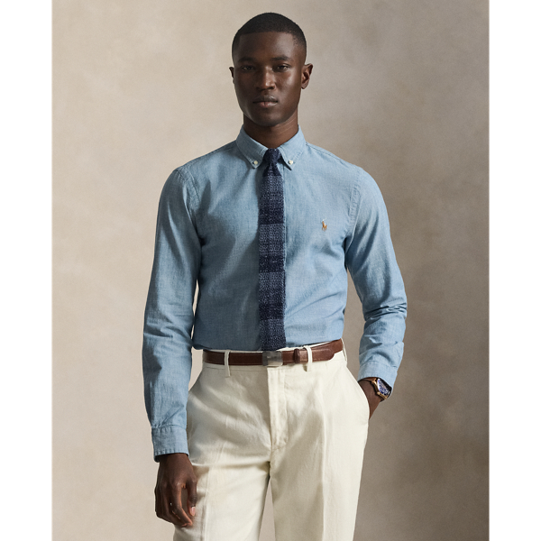 Our indigo-dyed cotton shirt is cut close to the body and stonewashed to give the lightweight fabric a weathered, lived-in look.