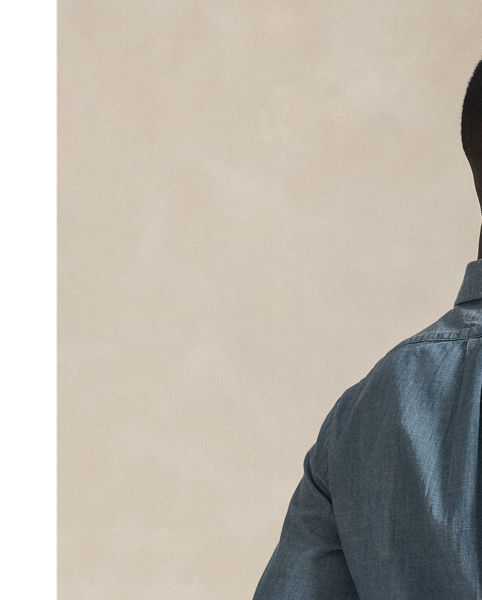 Our indigo-dyed cotton shirt is cut close to the body and stonewashed to give the lightweight fabric a weathered, lived-in look.