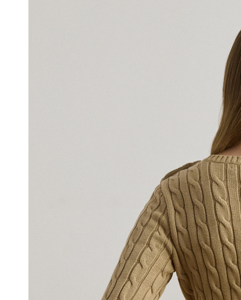 Lauren  Ralph Lauren Lauren updates the classic cable-knit jumper with signature button embellishments on the shoulder and an "LRL"-embroidered logo on the chest. Cut for a slim-fitting silhouette, it's knit from combed cotton for a soft hand.