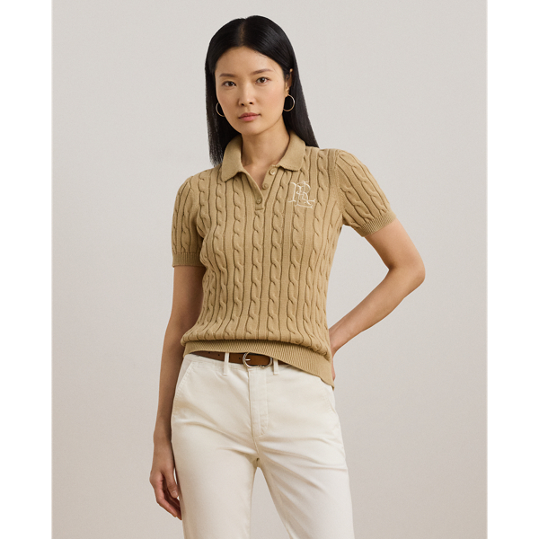 Crafted with combed cotton for a soft hand, this piece unites a timeless Polo shirt silhouette with the comfort of a cable-knit jumper. It's accented by Lauren's signature embroidered logo and "LRL"-engraved buttons.