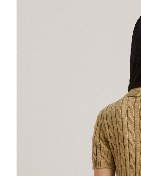 Crafted with combed cotton for a soft hand, this piece unites a timeless Polo shirt silhouette with the comfort of a cable-knit jumper. It's accented by Lauren's signature embroidered logo and "LRL"-engraved buttons.