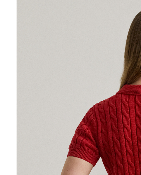 Crafted with combed cotton for a soft hand, this piece unites a timeless Polo shirt silhouette with the comfort of a cable-knit jumper. It's accented by Lauren's signature embroidered logo and "LRL"-engraved buttons.