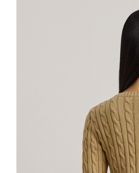 Crafted with gassed cotton for an amazingly soft feel, this classic cable-knit cardigan is accented with "LRL"-engraved buttons and Lauren's signature embroidered logo on the chest for an iconic Lauren  Ralph Lauren Lauren layering piece.