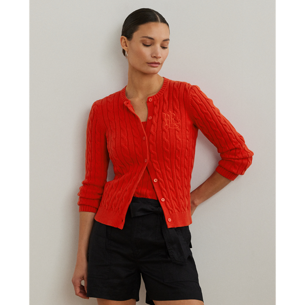 Crafted with gassed cotton for an amazingly soft feel, this classic cable-knit cardigan is accented with "LRL"-engraved buttons and Lauren's signature embroidered logo on the chest for an iconic Lauren  Ralph Lauren Lauren layering piece.