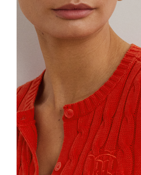 Crafted with gassed cotton for an amazingly soft feel, this classic cable-knit cardigan is accented with "LRL"-engraved buttons and Lauren's signature embroidered logo on the chest for an iconic Lauren  Ralph Lauren Lauren layering piece.