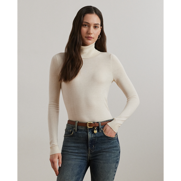 A timeless wardrobe essential, this slim-fitting roll neck jumper is realised in a luxuriously soft silk blend. A dainty “LRL”-engraved plaque on the hem adds signature style.
