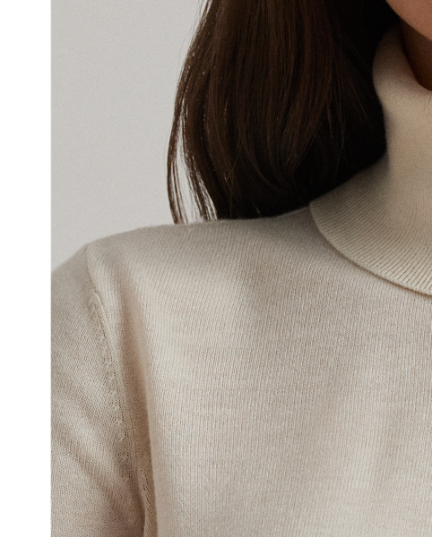 A timeless wardrobe essential, this slim-fitting roll neck jumper is realised in a luxuriously soft silk blend. A dainty “LRL”-engraved plaque on the hem adds signature style.