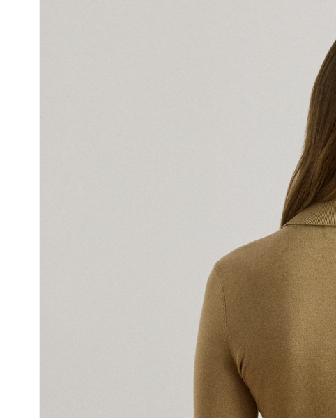 A timeless wardrobe essential, this slim-fitting roll neck jumper is realised in a luxuriously soft silk blend. A dainty “LRL”-engraved plaque on the hem adds signature style.