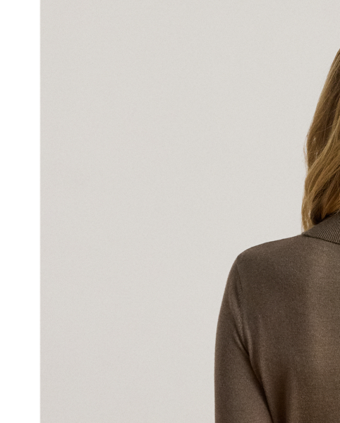 A timeless wardrobe essential, this slim-fitting roll neck jumper is realised in a luxuriously soft silk blend. A dainty “LRL”-engraved plaque on the hem adds signature style.