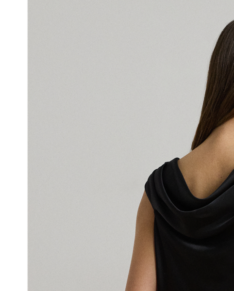 Delicate pleating enhances the graceful off-the-shoulder silhouette of this blouse, which is rendered in satin charmeuse for a beautiful sheen and a fluid drape.