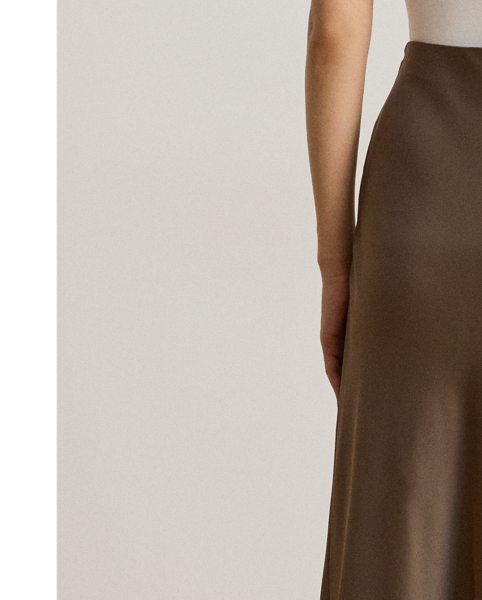 A staple piece that can be easily dressed up or down, this midi skirt is rendered in silky satin charmeuse for a fluid drape and subtle sheen.