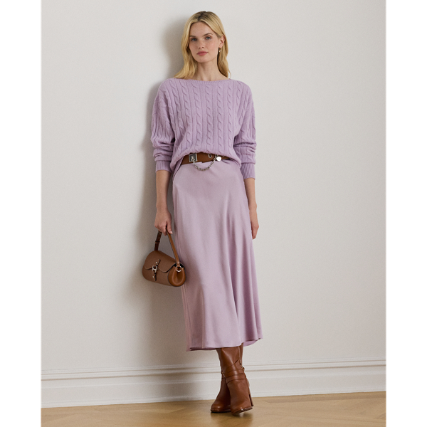 A staple piece that can be easily dressed up or down, this midi skirt is rendered in silky satin charmeuse for a fluid drape and subtle sheen.
