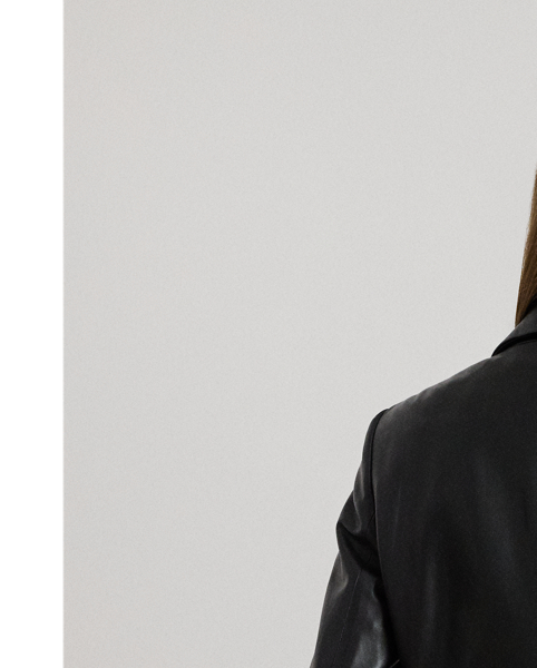 A luxurious layer for cooler days, this blazer is crafted from sumptuous lambskin leather, which offers a hint of stretch for ease of movement. Shoulder pads, princess seams and waist darts enhance its streamlined silhouette, while "Lauren  Ralph Lauren Lauren"-engraved horn-effect buttons add signature style.