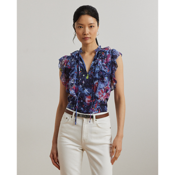 Cascading ruffles, flutter sleeves and crinkle georgette bring an airy look and feel to this tie-neck blouse, which showcases the season's painterly abstract motif.