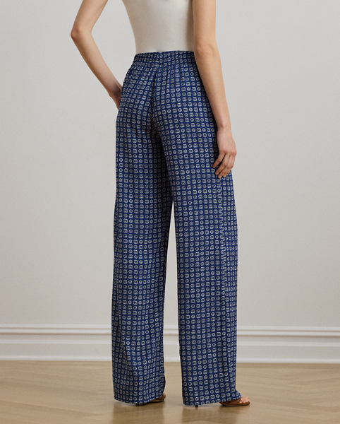 Tailored from fluid crepe de chine, these trousers unite a chic wide-leg silhouette with a comfortable drawcord waist. This version is updated with the season's stylised geometric print.