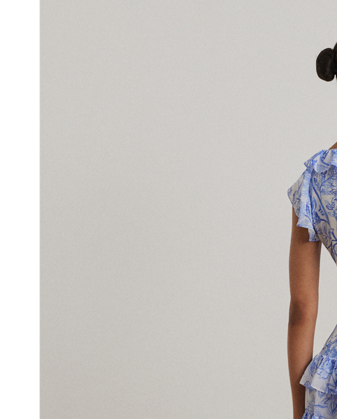 Crinkle georgette and a ruffle-trimmed tiered skirt bring effortless movement to this belted flutter-sleeve dress, which displays a blue and white floral motif rendered in the style of an ink sketch.