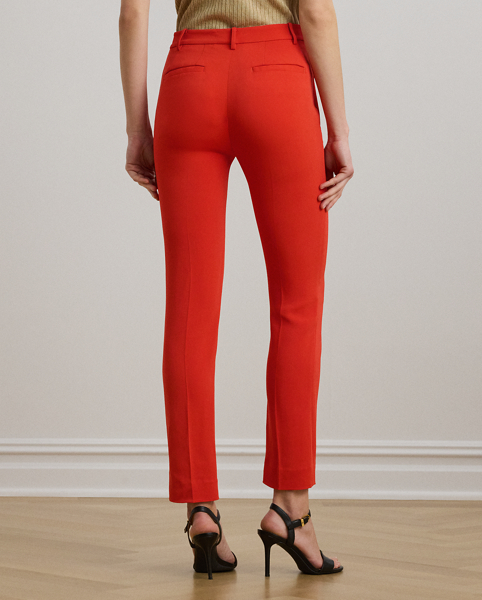 Tailored from smooth stretch cady, these slim trousers are detailed with back waist darts and crisp creases on each leg for a polished finish.